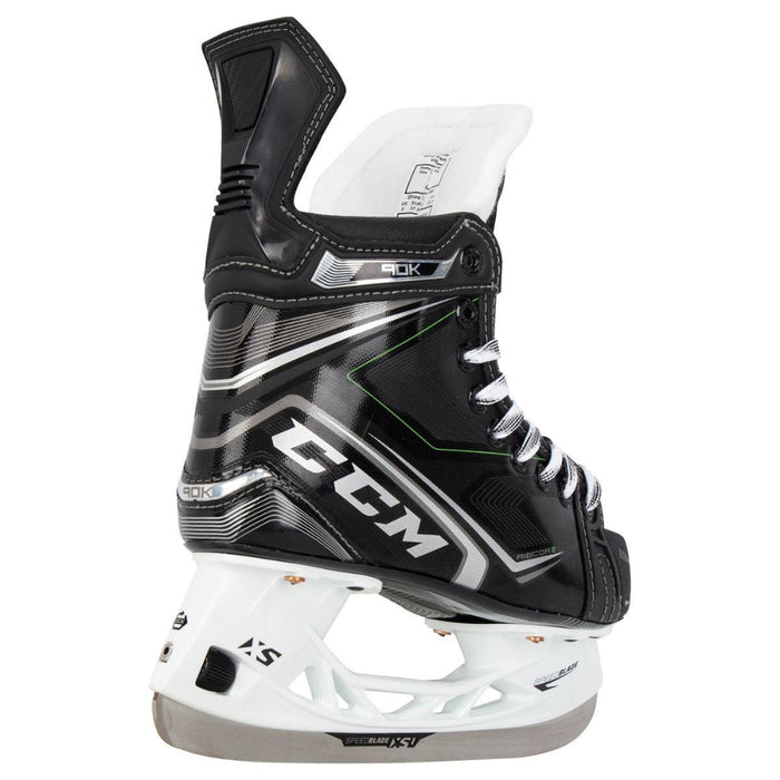 Black skates, with small green features. White laces and black lining