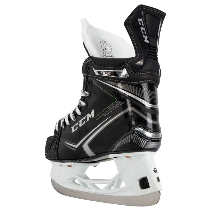 Black skates, with small green features. White laces and black lining