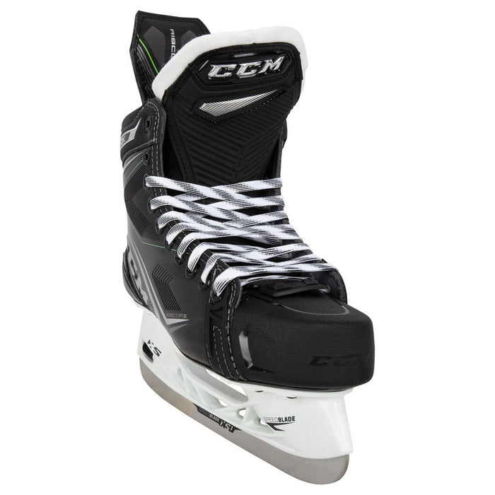 Black skates, with small green features. White laces and black lining