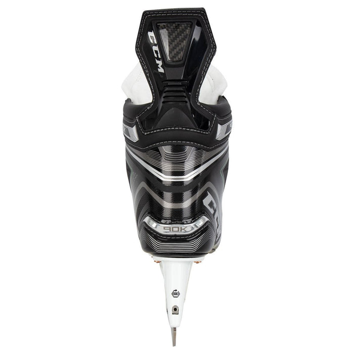 Black skates, with small green features. White laces and black lining