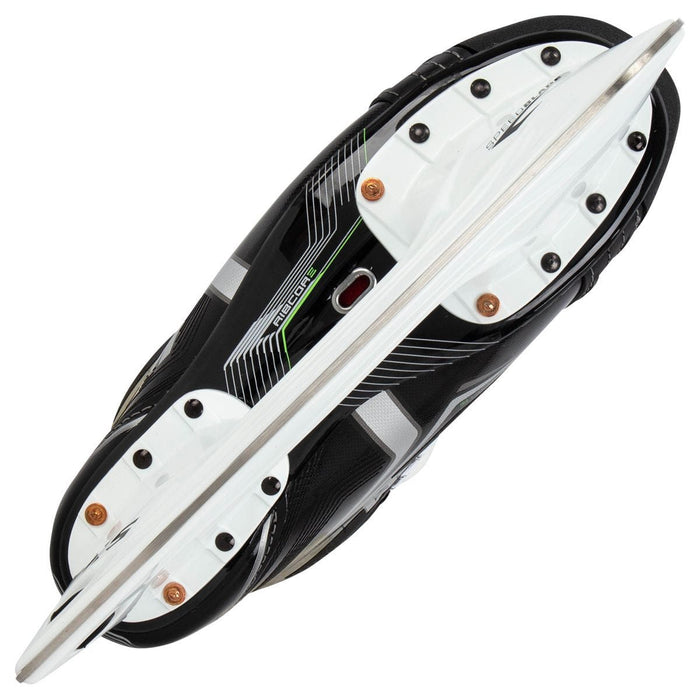 Black skates, with small green features. White laces and black lining