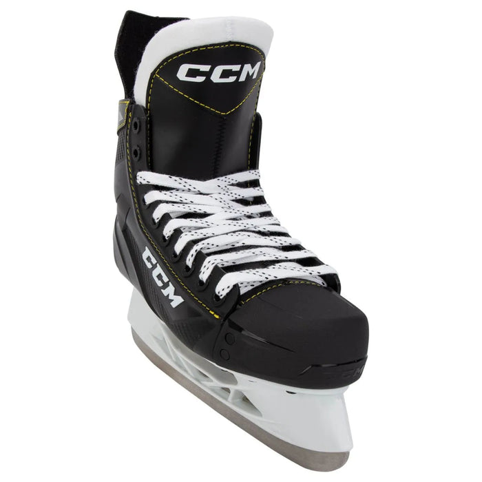 Black skates with yellow trim and white laces