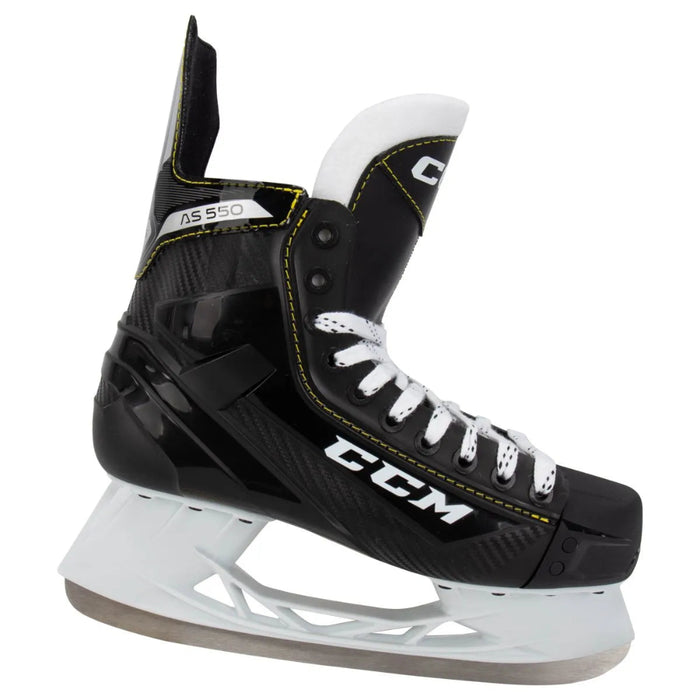 Black skates with yellow trim and white laces