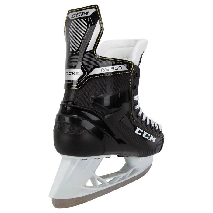 Black skates with yellow trim and white laces