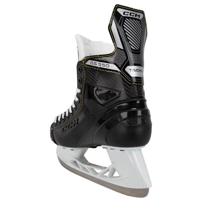 Black skates with yellow trim and white laces