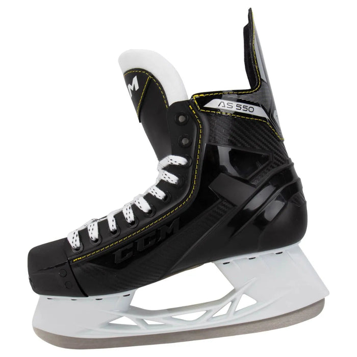 Black skates with yellow trim and white laces
