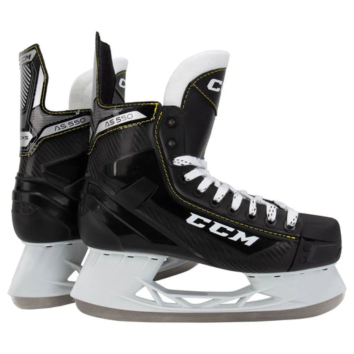 Black skates with yellow trim and white laces
