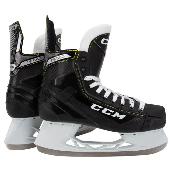 Black skates with yellow trim and white laces