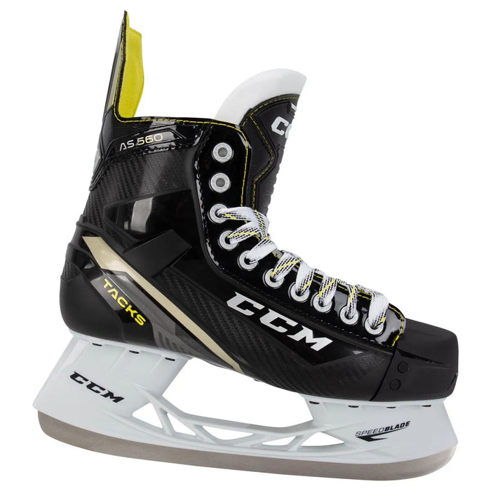 Black skates with gold accents, white laces and yellow lining