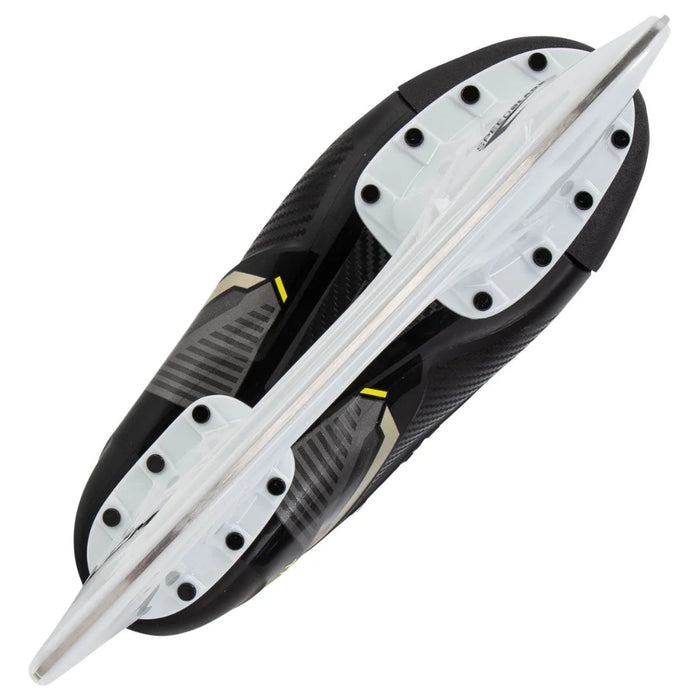 Black skates with gold accents, white laces and yellow lining