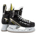Black skates with gold accents, white laces and yellow lining
