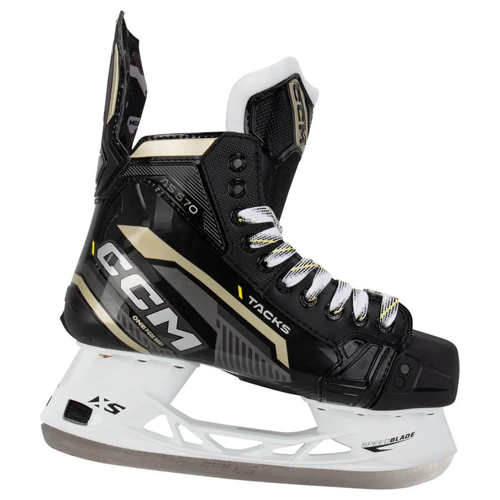 Black skates with gold accents, white laces and black lining
