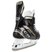 Black skates with gold accents, white laces and black lining