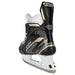 Black skates with gold accents, white laces and black lining