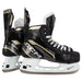 Black skates with gold accents, white laces and black lining