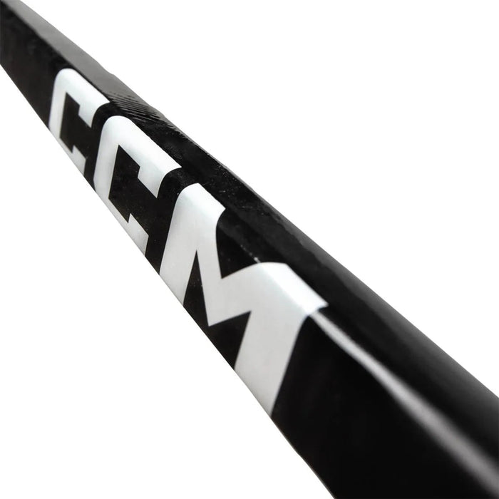 black hockey stick with white text