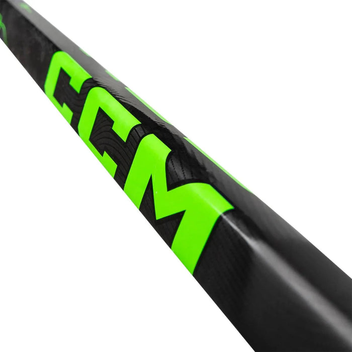 black stick with neon green and purple writing