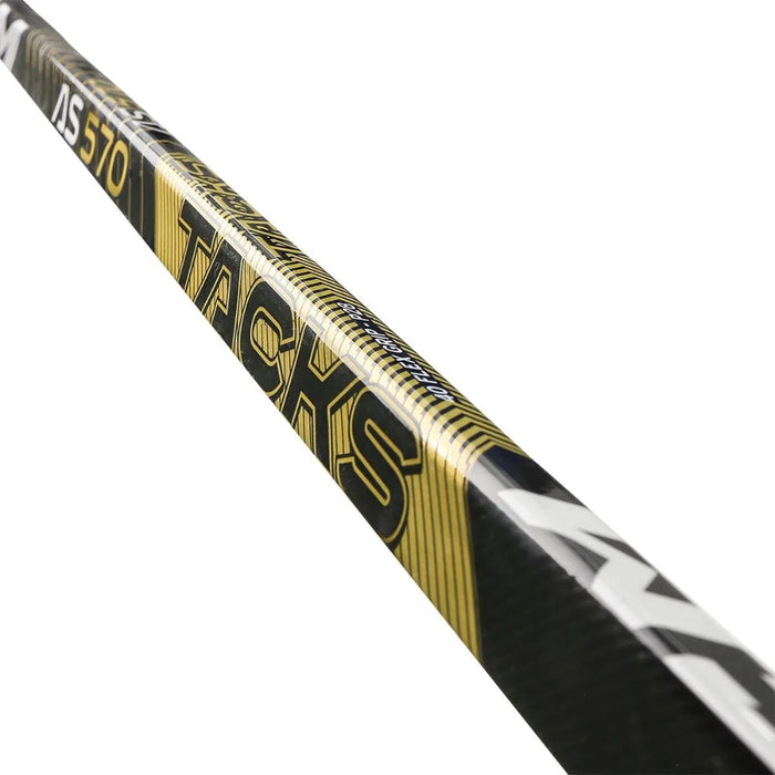 Black stick with yellow blade and details