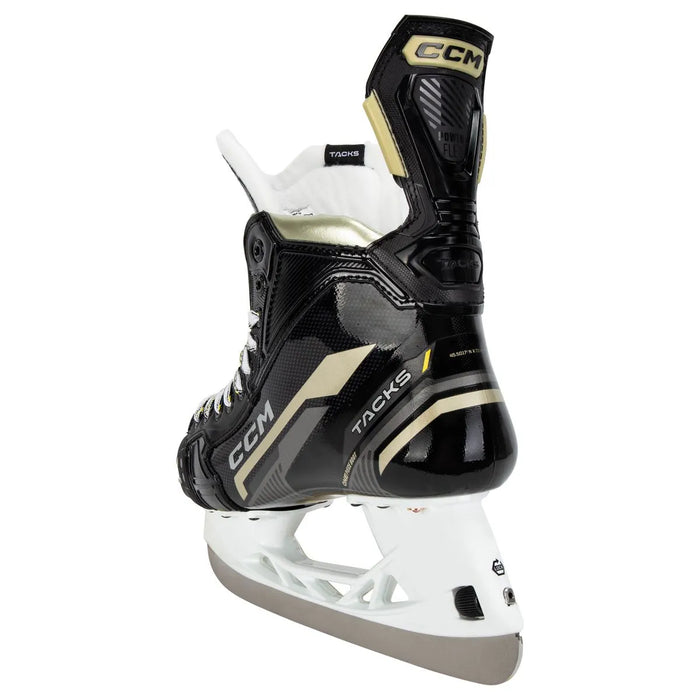 Black skates with gold accents, white laces and black lining