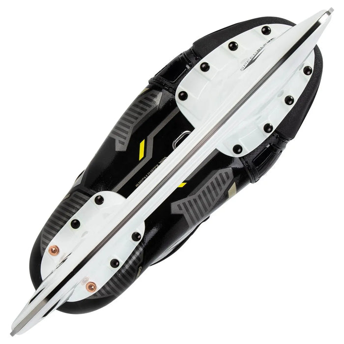 Black skates with gold accents, white laces and black lining