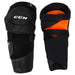 Black referee shin guards with orange lining